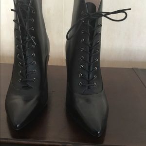 Not your old fashioned “granny boots”. Black leather, tie up in front.